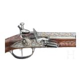 A magnificent pair of German chiselled flintlock pistols, circa 1780