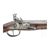 A magnificent pair of German chiselled flintlock pistols, circa 1780