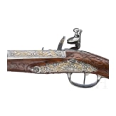 A magnificent pair of German chiselled flintlock pistols, circa 1780