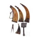 Four German powder flasks, 18th century, and two tools