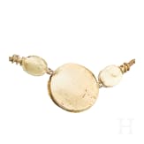 A Greek gold necklace with three cabochons, mid-4th century B.C.