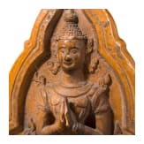 An orange-glazed front of a Thai roof tile (end of a monk tile) decorated with a temple guardian, circa 1900