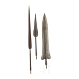 Three African lance tips with a presentation stand
