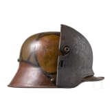 Stahlhelm M16 mit Tarnanstrich und Stirnschutzplatte