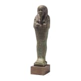 A faience ushabti with nine-line hieroglyphic inscription, 26th Dynasty (Saite Period), mid-1st millennium B.C.
