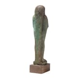 A faience ushabti with nine-line hieroglyphic inscription, 26th Dynasty (Saite Period), mid-1st millennium B.C.