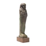 A faience ushabti with nine-line hieroglyphic inscription, 26th Dynasty (Saite Period), mid-1st millennium B.C.
