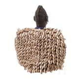 A Nigerian female twin figure (ere ibeji) of the Yewa in a cowry cloak, Nigeria, 20th century