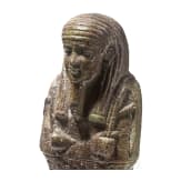 A faience ushabti with nine-line hieroglyphic inscription, 26th Dynasty (Saite Period), mid-1st millennium B.C.
