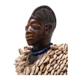 A Nigerian female twin figure (ere ibeji) of the Yewa in a cowry cloak, Nigeria, 20th century
