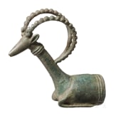 A bronze stone head protome, the setting for a whetstone, Luristan, circa 1000 B.C.
