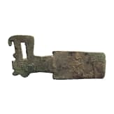 A Chinese flat bronze axe with animal head end, Western Zhou, 8th - 6th century B.C.