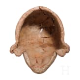 A Hellenistic terracotta theatre mask of the New Comedy, naive Ephebe type, 2nd century B.C.