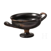 Two Greek bowls with handles made of black-glazed pottery, 4th century B.C.