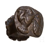Five impressions of seals on clay, a clay model and a bronze punch with bird of prey, Greek, late antique and early Islamic, 3rd century B.C. - 8th century A.D.