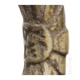 A bow brooch with bone cladding and Etruscan inscription, 7th century B.C.