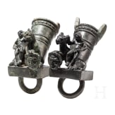 Two Roman mirror-like yoke fittings with Eros on panther and satyr mask, bronze, late 1st - mid-3rd century A.D.