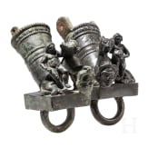 Two Roman mirror-like yoke fittings with Eros on panther and satyr mask, bronze, late 1st - mid-3rd century A.D.