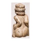 A Roman erotic gambling bone dice in the shape of a squatting woman, 2nd - 3rd century A.D.