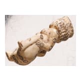 A Roman erotic gambling bone dice in the shape of a squatting woman, 2nd - 3rd century A.D.