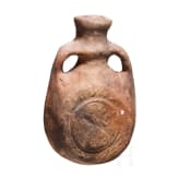 An early Byzantine pilgrim's bottle, mould-shaped ceramic, 6th - 7th century