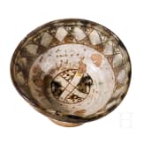 A Middle Byzantine glazed bowl with ring stand, sgraffito ware, 11th century A.D.