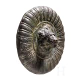A solid bronze appliqu&eacute; with a central lion head based on an antique model, 19th century