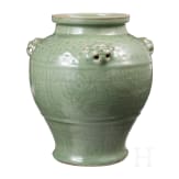 A Chinese molded Longquan celadon jar, probably Yuan Dynasty