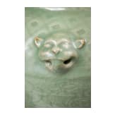 A Chinese molded Longquan celadon jar, probably Yuan Dynasty