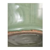 A Chinese molded Longquan celadon jar, probably Yuan Dynasty