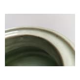 A Chinese molded Longquan celadon jar, probably Yuan Dynasty