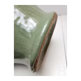 A Chinese molded Longquan celadon jar, probably Yuan Dynasty