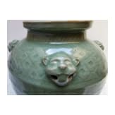 A Chinese molded Longquan celadon jar, probably Yuan Dynasty