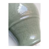 A Chinese molded Longquan celadon jar, probably Yuan Dynasty