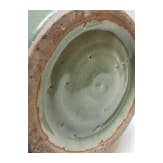 A Chinese molded Longquan celadon jar, probably Yuan Dynasty
