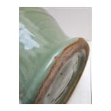 A Chinese molded Longquan celadon jar, probably Yuan Dynasty