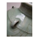 A molded Longquan celadon vase, probably Ming Dynasty