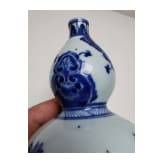 A Chinese blue and white double-gourd porcelain vase with flowers, probably Kangxi period