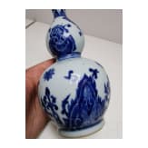 A Chinese blue and white double-gourd porcelain vase with flowers, probably Kangxi period