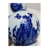 A Chinese blue and white double-gourd porcelain vase with flowers, probably Kangxi period