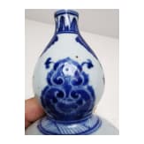 A Chinese blue and white double-gourd porcelain vase with flowers, probably Kangxi period