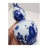 A Chinese blue and white double-gourd porcelain vase with flowers, probably Kangxi period