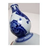 A Chinese blue and white double-gourd porcelain vase with flowers, probably Kangxi period