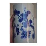 A Chinese blue and white brush pot showing a scholar in landscape, probably Kangxi period (18th century)