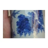 A Chinese blue and white brush pot showing a scholar in landscape, probably Kangxi period (18th century)