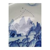 A Chinese blue and white porcelain charger with river and mountain scene, probably 19th/20th century