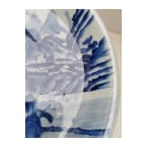 A Chinese blue and white porcelain charger with river and mountain scene, probably 19th/20th century