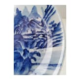 A Chinese blue and white porcelain charger with river and mountain scene, probably 19th/20th century