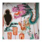 A pair of Chinese famille rose table lamps, a bird cage, a guardian lion, a F&egrave;nghu&aacute;ng and a pagoda, 20th century