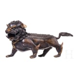A Chinese bronze of a striding guardian lion, circa 1900